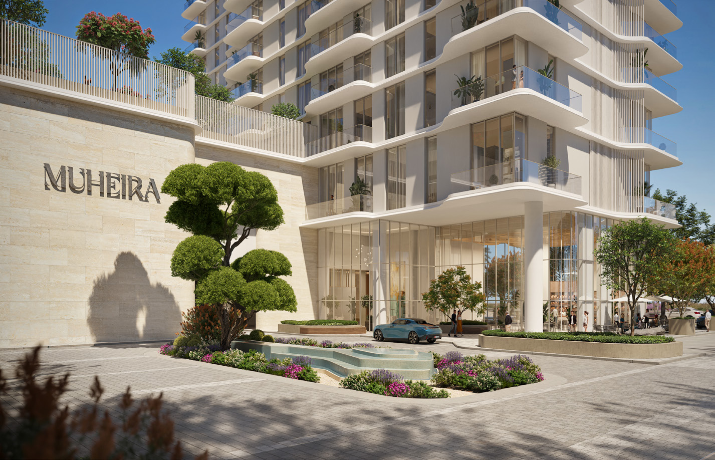 Stone-clad entrance with Muheira sign, sculpted tree and water feature
