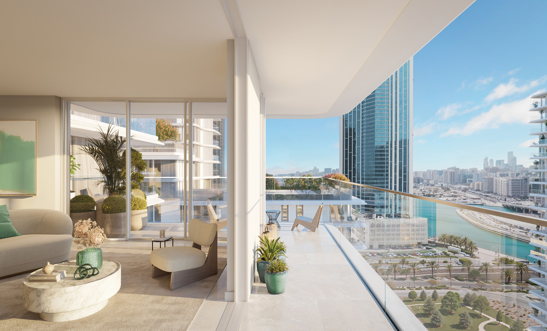 Living room opening onto a wide glass balcony overlooking water and city