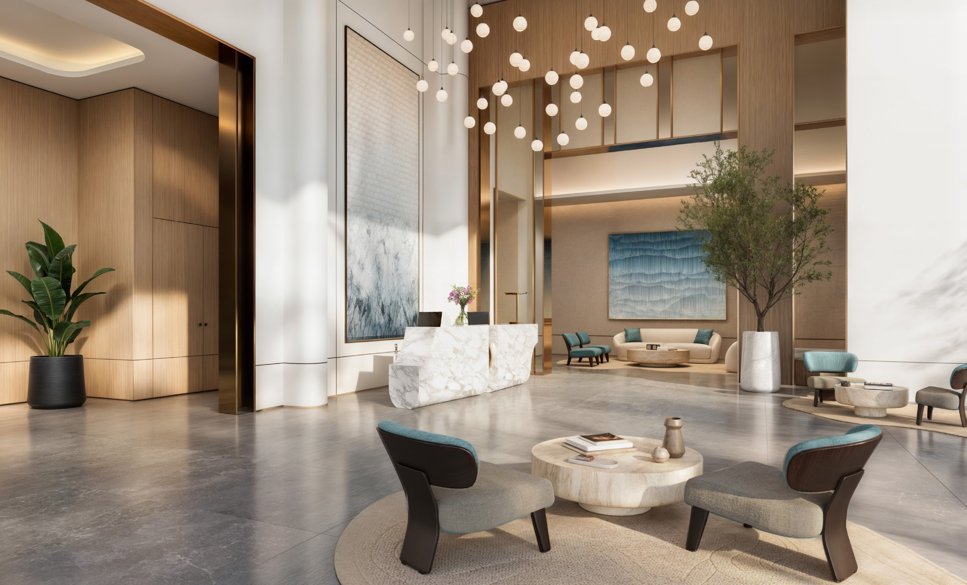 Double-height lobby with marble reception desk and hanging globe lights