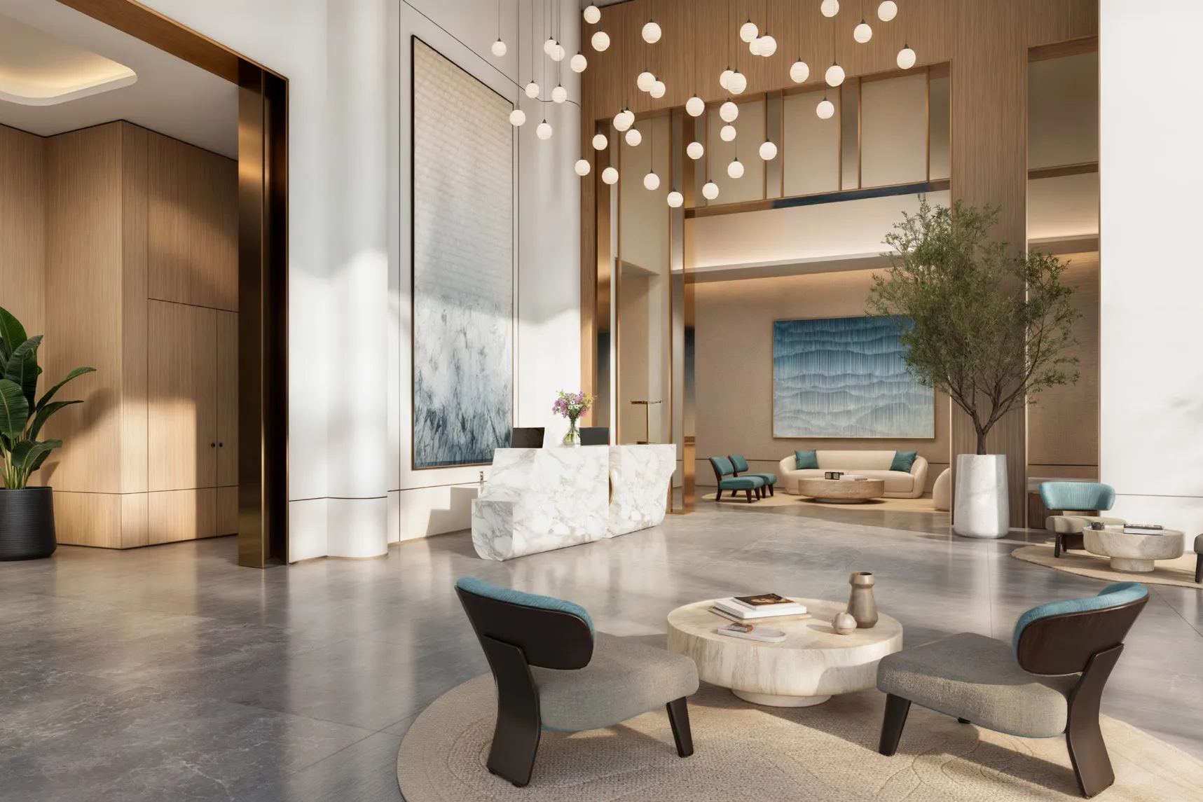 Double-height lobby with marble reception desk and hanging globe lights